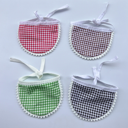 Red, Brown, Green and Black gingham Pet Neckwear arranged with tied neck loops and curved bib panels.