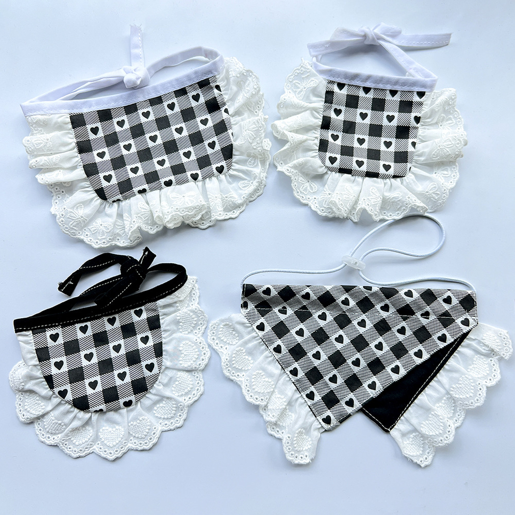 Four styles of black-and-white heart-check Pet Neckwear with white lace-look trim, showing their different shapes and neck fastenings.