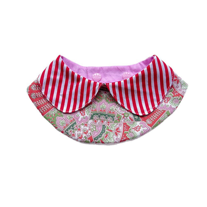 Red pet neckwear with striped rounded flaps and a floral bib panel on white.