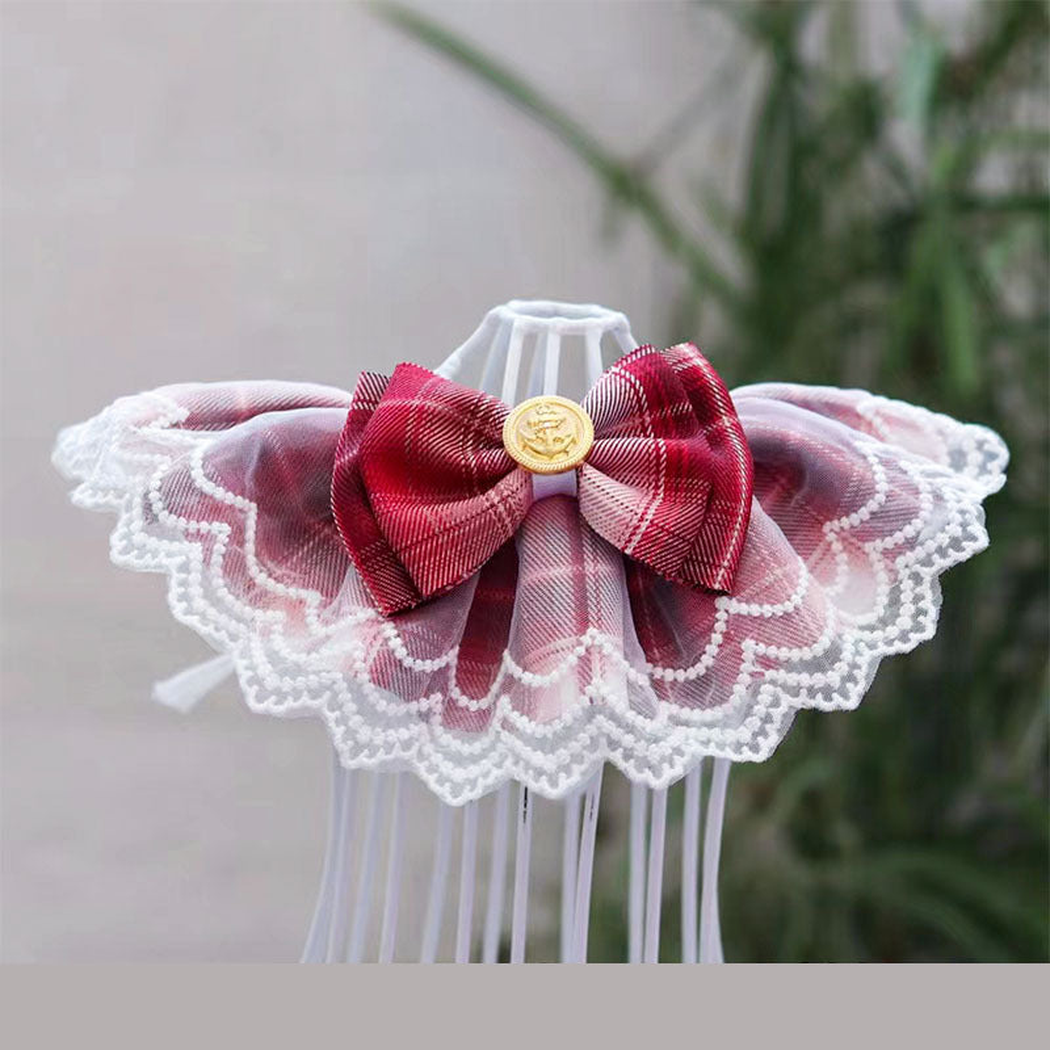 Rose Red plaid pet neckwear with a prominent bow, layered white scalloped lace-look edging and a gold-tone ornament.