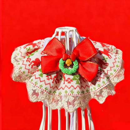Wreath pet neckwear with a red bow, green wreath accent and ruffled lace-look edge