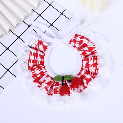 Red gingham Pet Neckwear spread into a rounded ruffle, with bow ties, cherry accents and white lace-look trim.