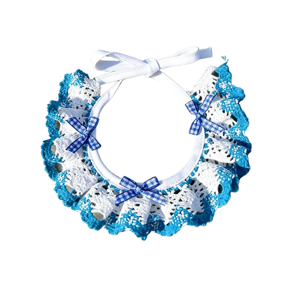 Turquoise and white ruffled pet neckwear with blue gingham bows and white ties, displayed on white.