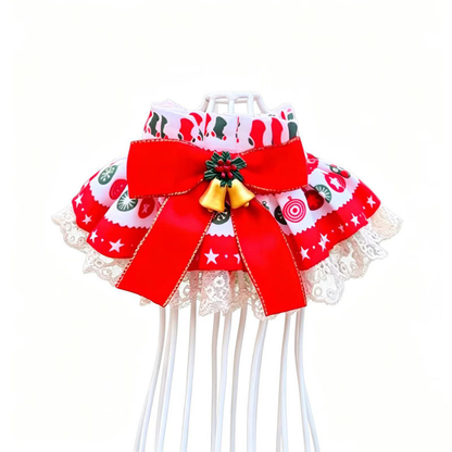 Bells Pet Neckwear with a large bow, bell-shaped ornaments and lace-look border on a white display stand.