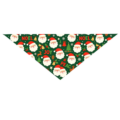 Green Santa pet neckwear with a triangular shape and Santa face pattern, laid flat.