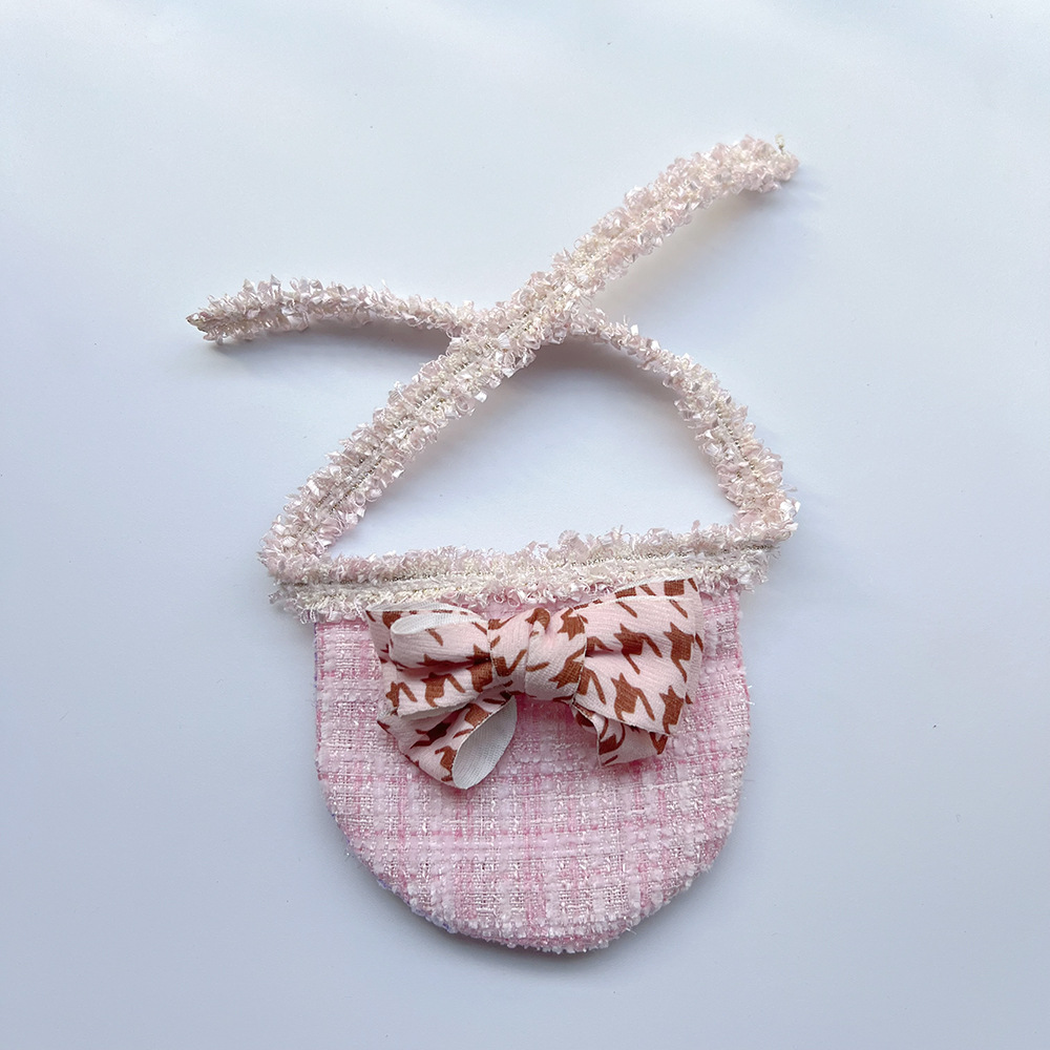 Pink Check Pet Neckwear with a rounded checked bib, brown-patterned pink bow, and textured neck ties.