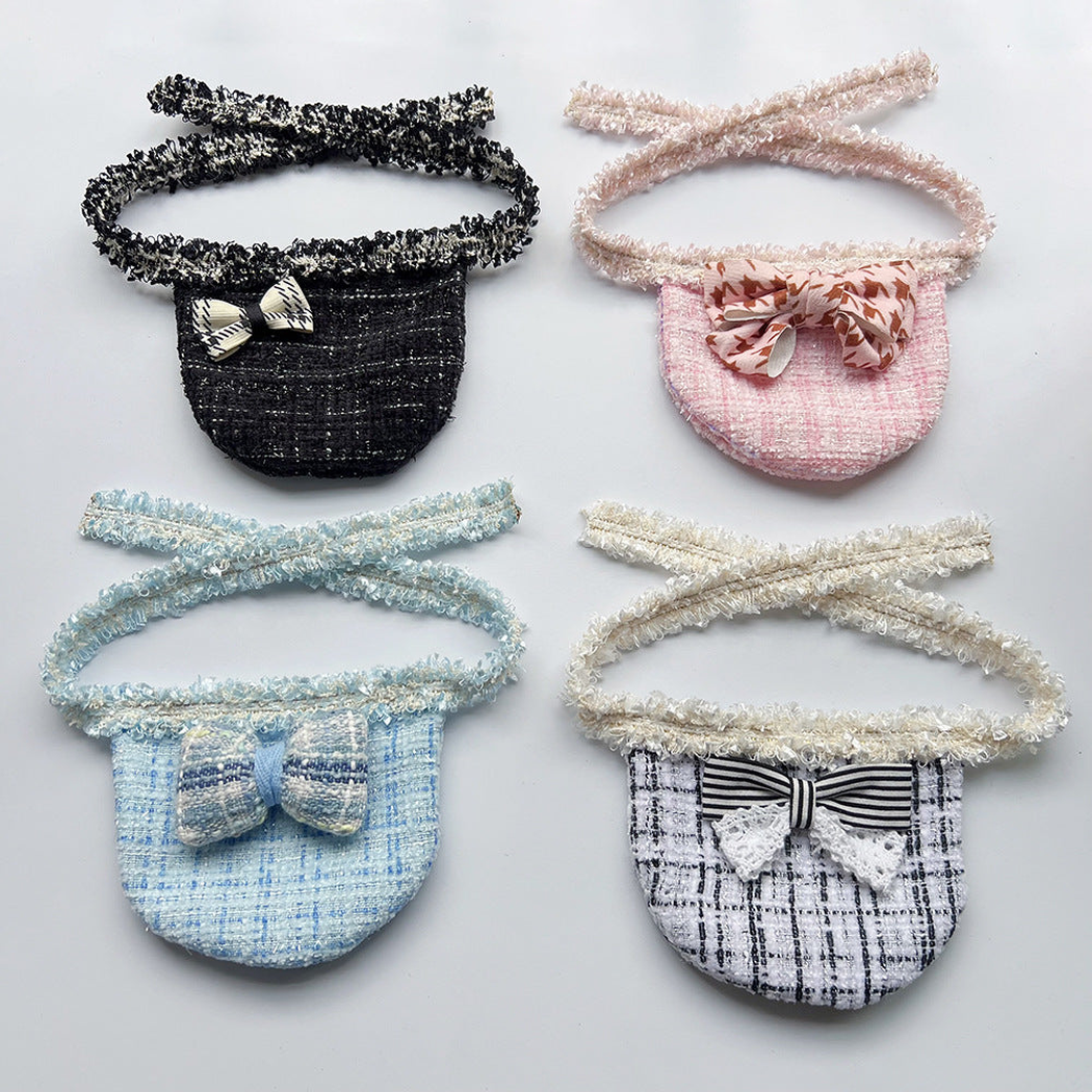 Four styles of Pet Neckwear with rounded bib panels, decorative bows, and textured neck ties.