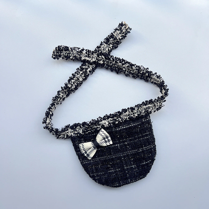 Black Grid Pet Neckwear with a rounded bib, black-and-white geometric bow, and textured neck ties.
