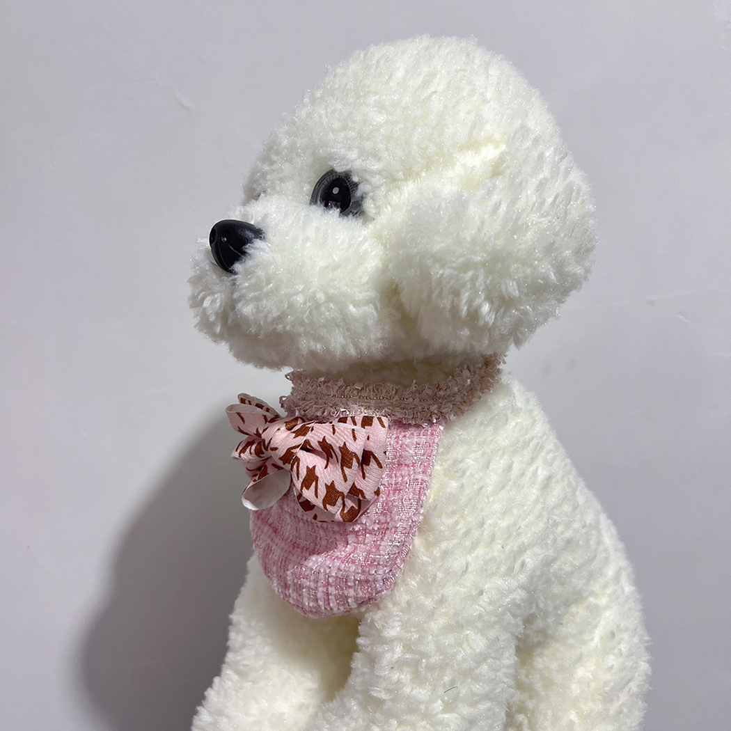 White plush dog wearing Pink Check Pet Neckwear, side view showing the bib and neck ties.