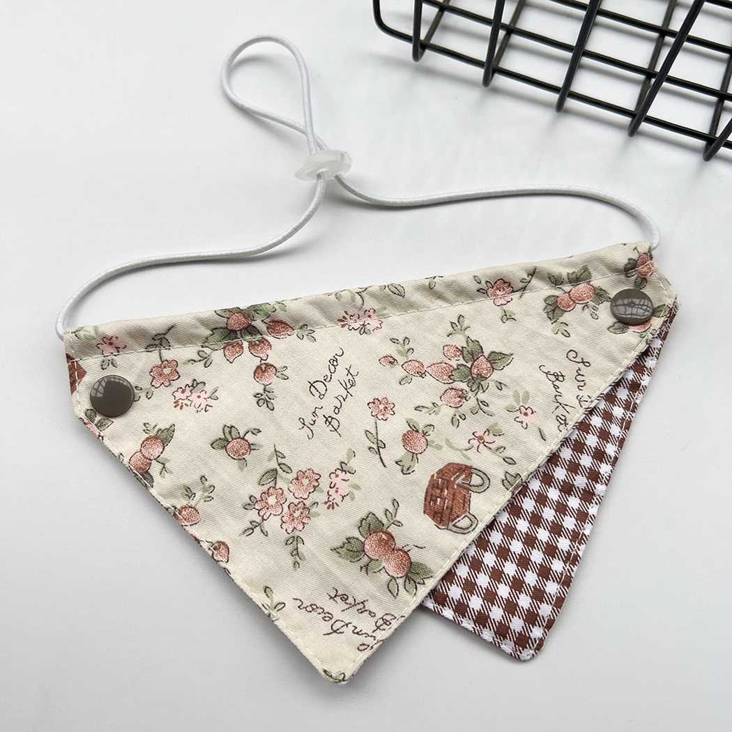 Brown Bib Pet Neckwear with floral and basket motifs, a brown gingham lower panel and a white cord loop.