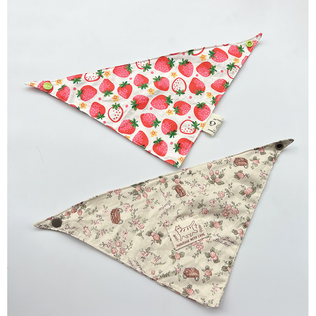 Red Bandana and Brown Bandana Pet Neckwear laid flat to show their triangular shapes, patterns and corner snaps.