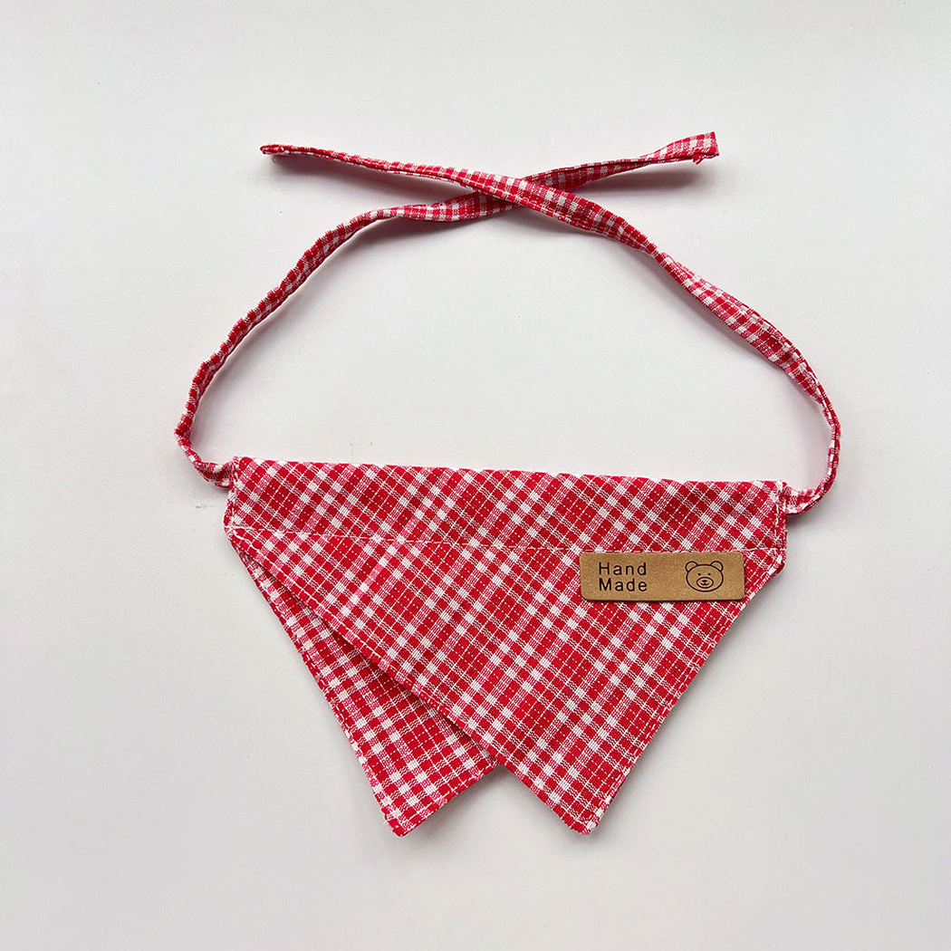 Red Bib pet neckwear with white checks, overlapping pointed panels and matching straps.