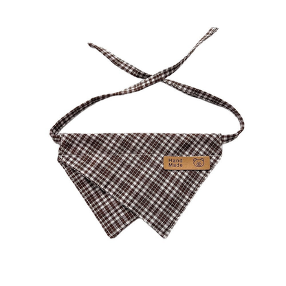 Brown Bib pet neckwear with white checks, overlapping pointed panels and matching straps.