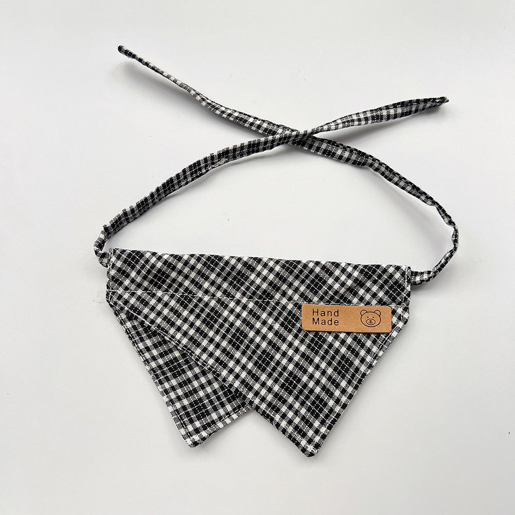 Black Bib pet neckwear with white checks, overlapping pointed panels and matching straps.
