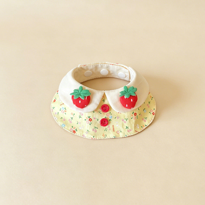 Yellow Floral pet neckwear with ivory neck panels, strawberry decorations and red front buttons.