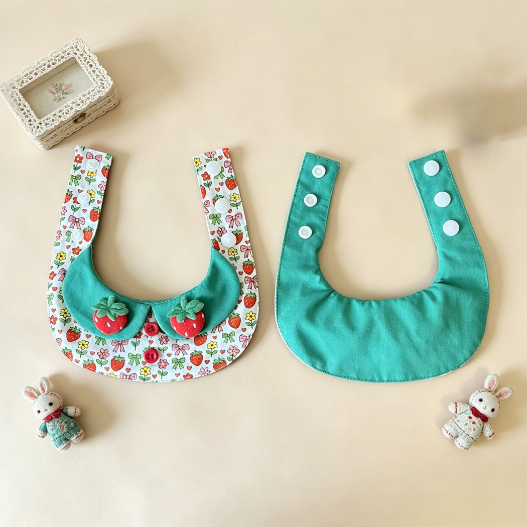 Front and back views of Hearts pet neckwear laid open, showing the green reverse and white snap fasteners.