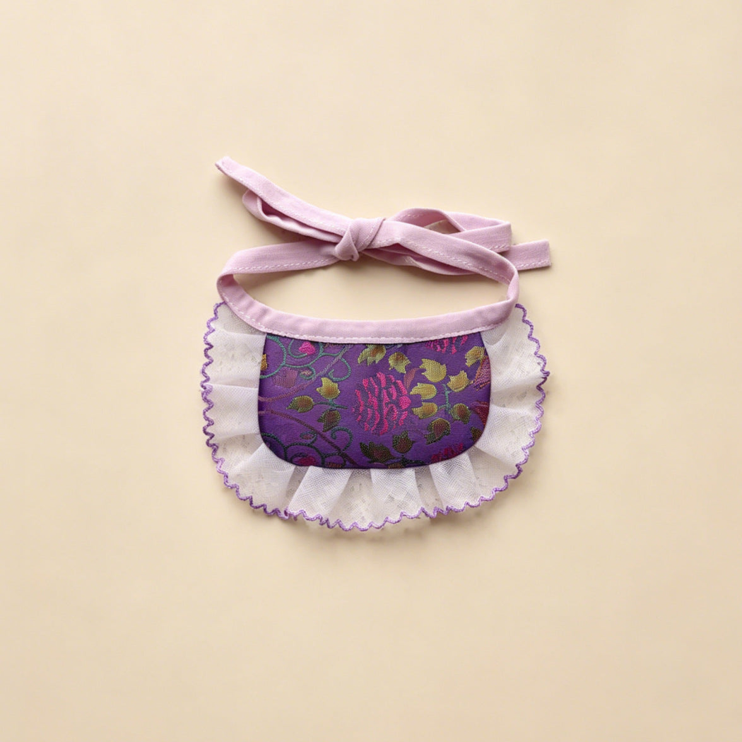 Purple Narrow pet neckwear with pink flowers, green leaves, a narrow white ruffle and bow ties.
