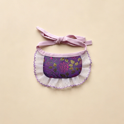 Purple Narrow pet neckwear with pink flowers, green leaves, a narrow white ruffle and bow ties.