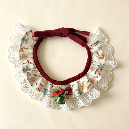 Trimmed Gingerbread Pet Neckwear with ivory patterned ruffles, white lace-look edging, striped bow and green bell.