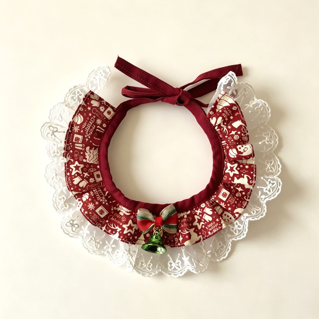 Trimmed Reindeer Pet Neckwear with burgundy patterned ruffles, white lace-look edging, striped bow and green bell.
