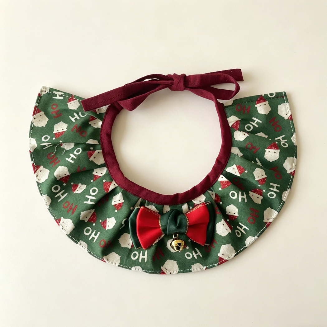 Santa Ruffle Pet Neckwear with green Santa print, burgundy ties, red and green bow and gold-tone bell.