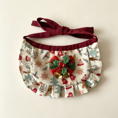 Gingerbread Bib Pet Neckwear with ivory patterned panel, ruffled border, holly-decorated bow and two gold-tone bells.