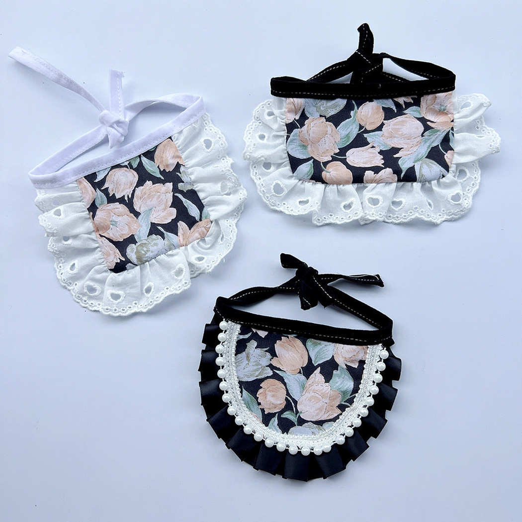 Round, Upright and Wide floral Pet Neckwear with contrasting ruffled borders and neck ties.