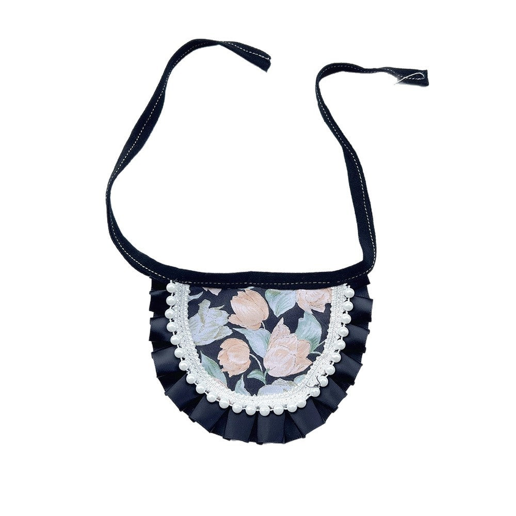 Round floral Pet Neckwear with black pleated edging, white bead trim and black ties.