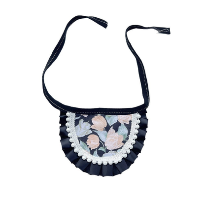Round floral Pet Neckwear with black pleated edging, white bead trim and black ties.
