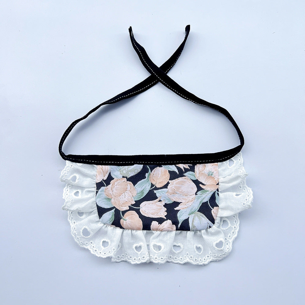 Wide floral Pet Neckwear with black ties and white ruffles featuring heart-shaped eyelets.