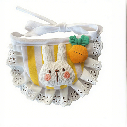 Yellow striped pet neckwear with a raised rabbit face, orange carrot, white eyelet ruffle and ribbon ties on a white background.