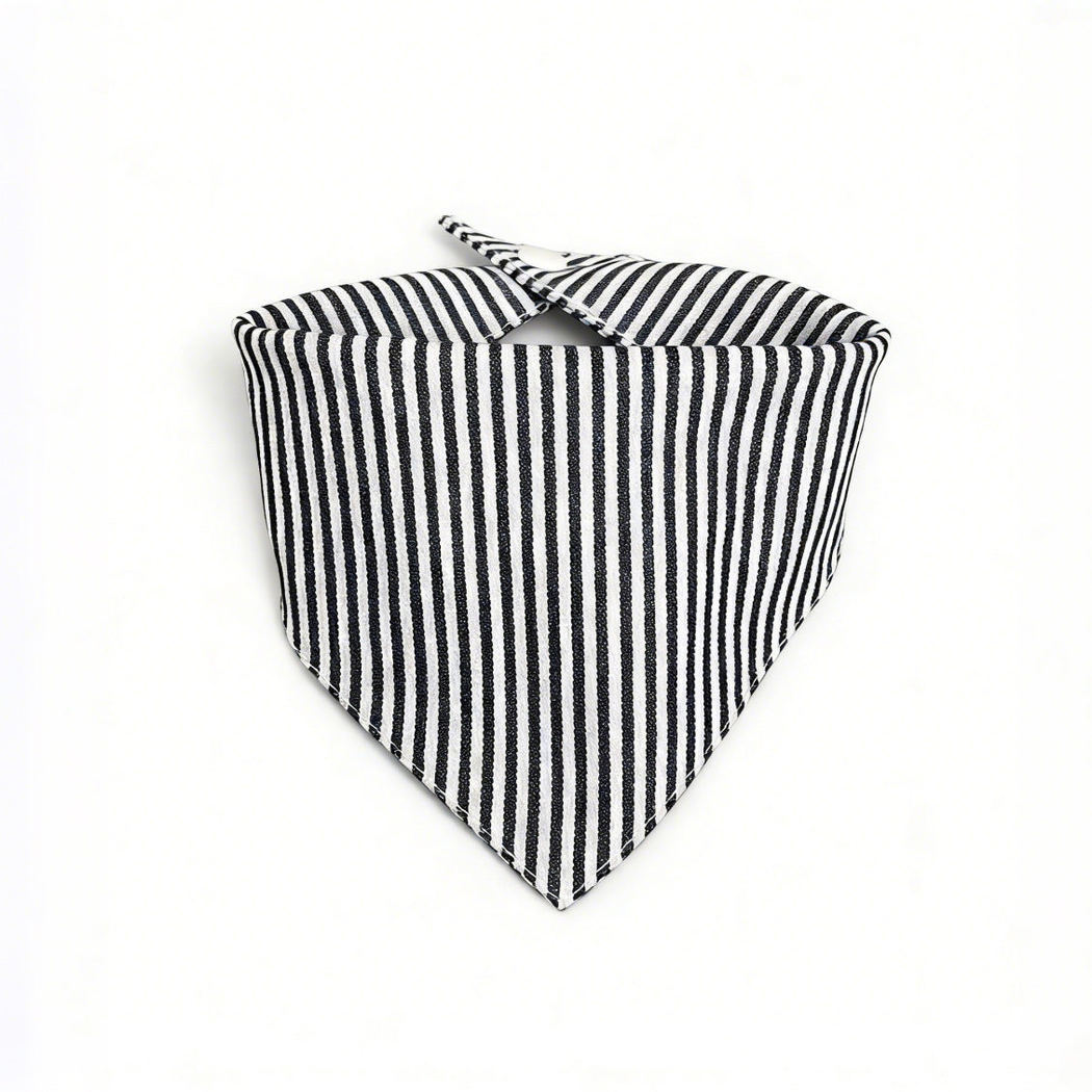 Black / White striped pet neckwear with a triangular front and overlapping neck tabs on a white background.