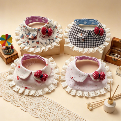 Four styles of pet neckwear with rounded bib fronts, lace ruffles and red dotted bows.