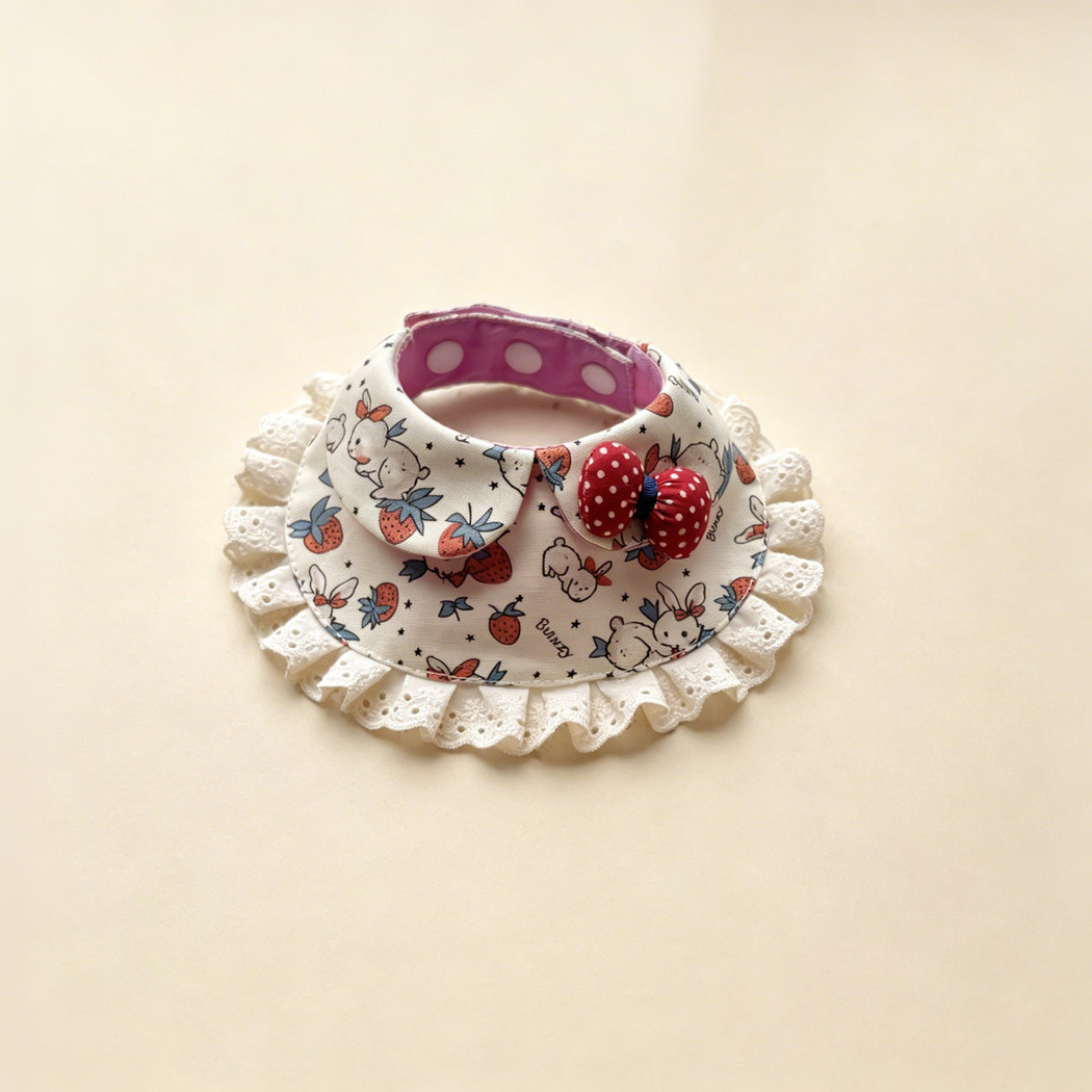 Strawberries pet neckwear with rabbit motifs, ivory lace ruffles and a red dotted bow.