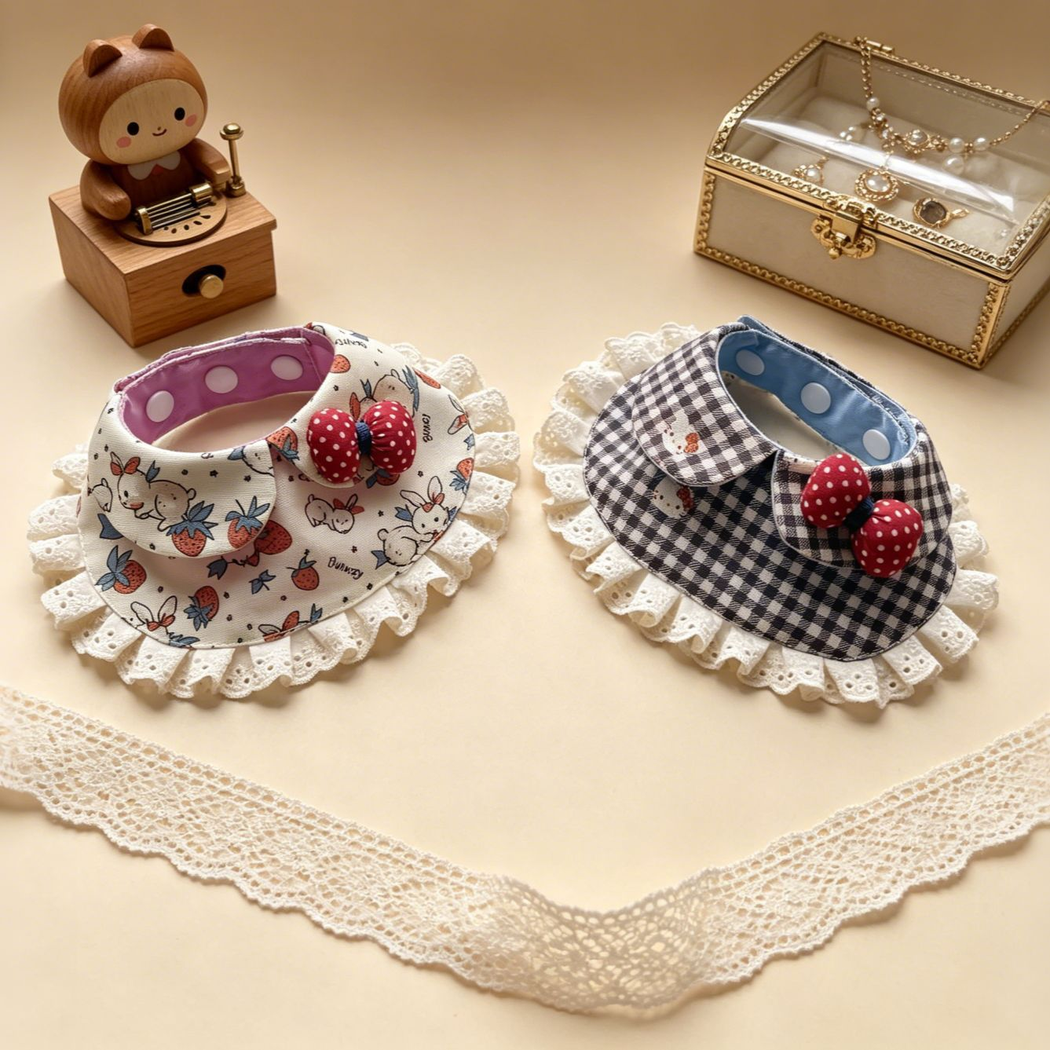 Strawberries and Gingham pet neckwear at an angle, revealing contrasting inner neckbands and ruffled edges.