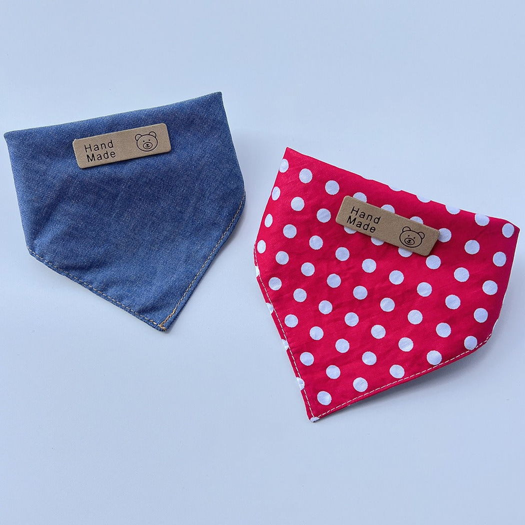 Blue and Red pet neckwear displayed folded, with white polka dots on the Red style.
