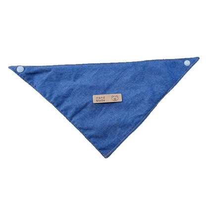 Blue triangular pet neckwear spread flat on white with corner snaps and a small bear label.