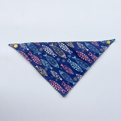 Navy Bandana pet neckwear spread flat with colorful fish motifs and yellow corner snaps