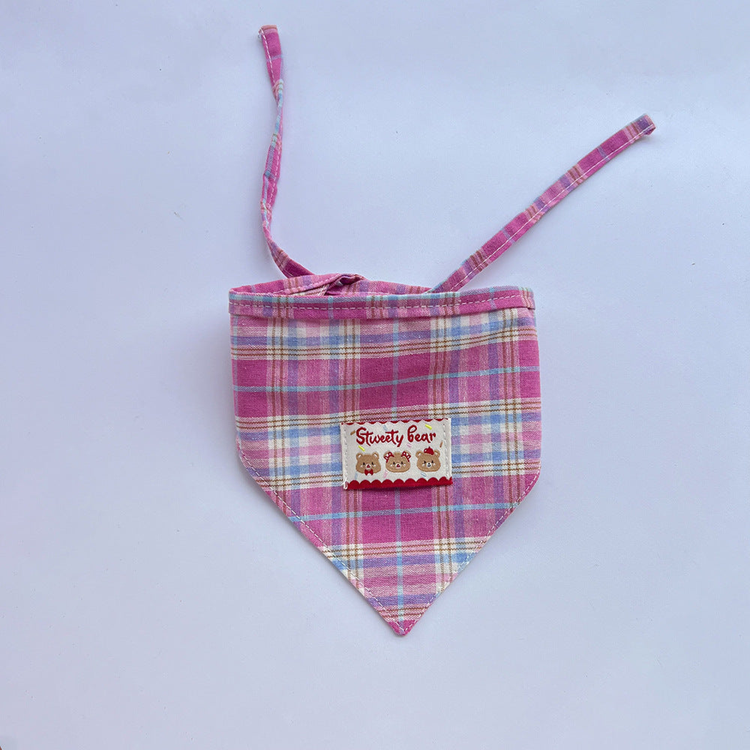 Pink plaid Pet Neckwear with a triangular front, bear patch, and extended ties.