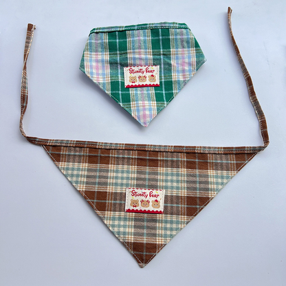 Brown plaid Pet Neckwear spread open with long ties beneath a folded Green version.