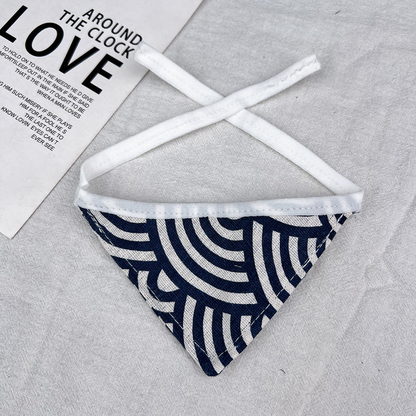 Geometric Bandana pet neckwear with navy and ivory curved lines, triangular shape and white ties.
