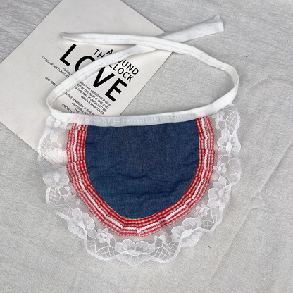 Reverse of Flower Bib pet neckwear with a plain blue panel, red-and-white checked border and white lace-look edging.