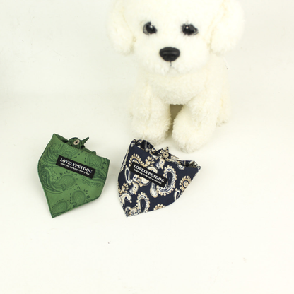 Green and Navy paisley pet neckwear arranged with upper snap fasteners visible beside a white dog mannequin.