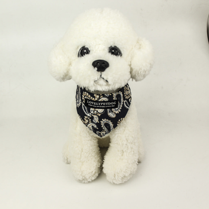 White dog mannequin wearing Navy paisley pet neckwear with a pointed front.