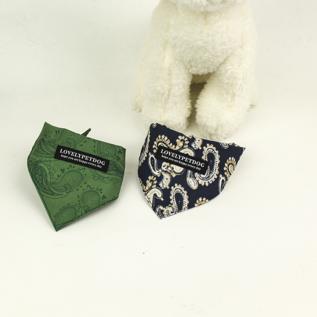 Green and Navy paisley pet neckwear folded side by side, with curved upper edges and pointed fronts.