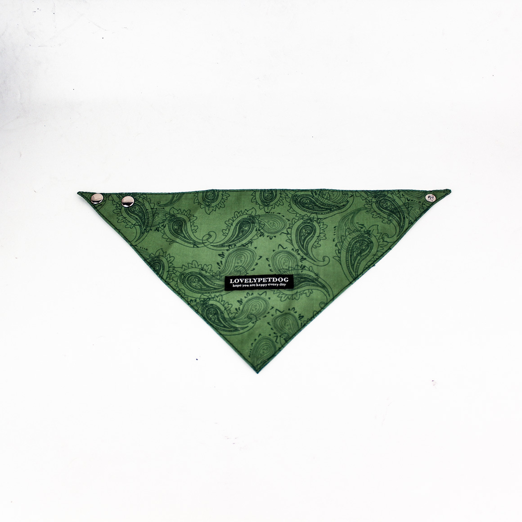 Green triangular pet neckwear spread flat, with dark paisley linework and snap fasteners.