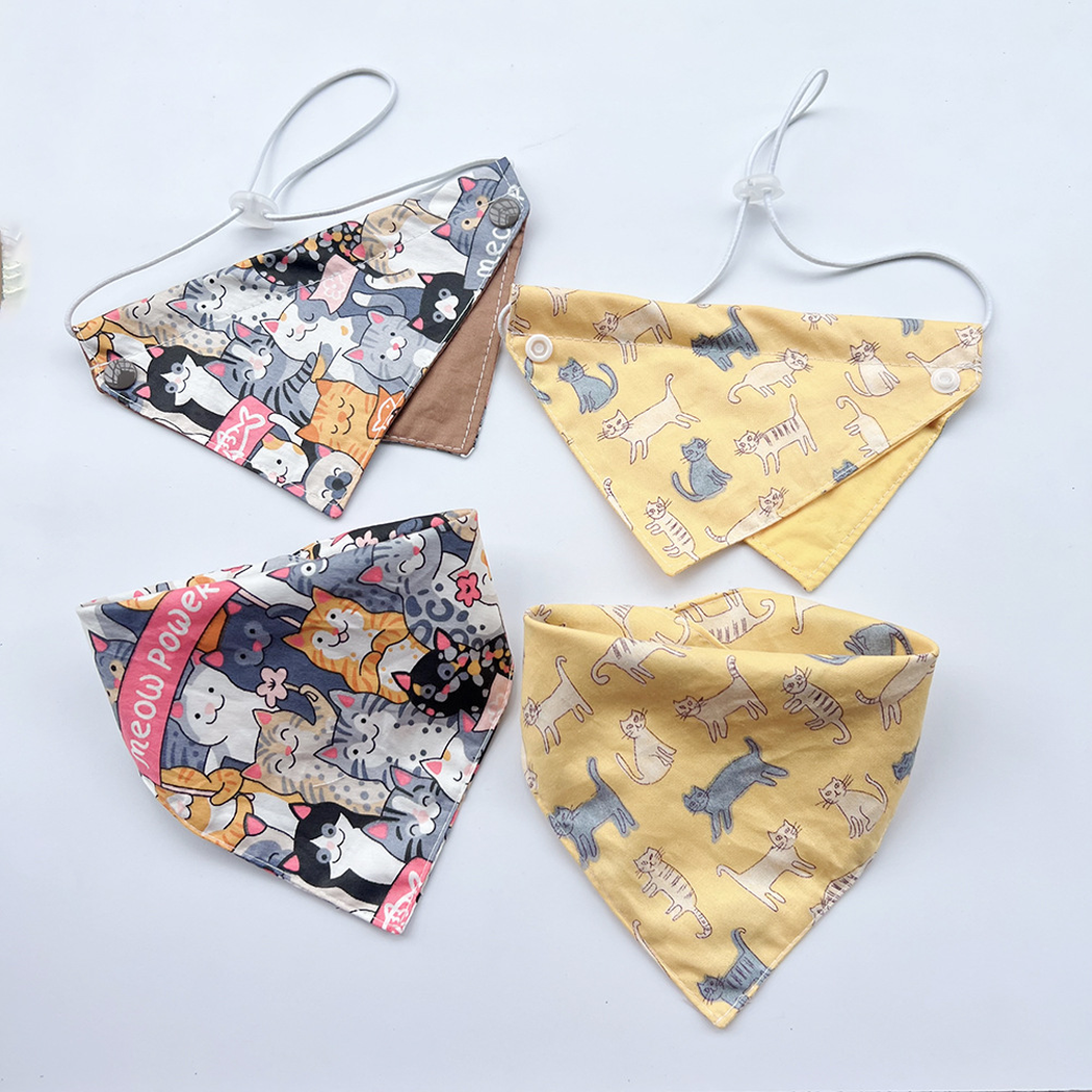Four cat-print pet neckwear styles arranged together, with corded bibs above dimensional bandana views.