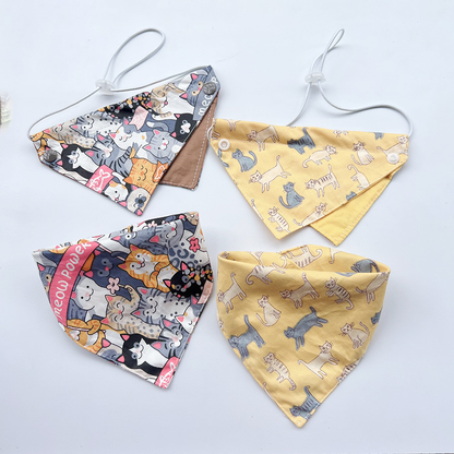 Four cat-print pet neckwear styles arranged together, with corded bibs above dimensional bandana views.