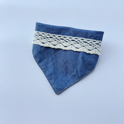 Blue Pet Neckwear with white openwork lace trim and a pointed folded shape.