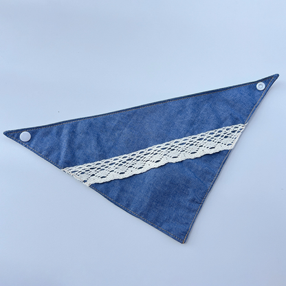 Blue triangular Pet Neckwear fully opened, with white lace trim and snaps at both upper corners.